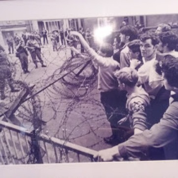 Civilian protesters with barbed wire and soldiers